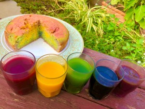 DIY Organic Food Colouring - containers of food colors next to a swirled cake