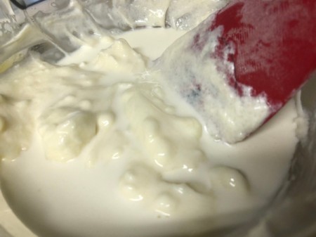 adding cream to filling