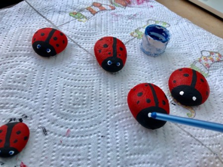 Stone Ladybug Garden Ornaments - paint white dots for the eyes and blue pupils