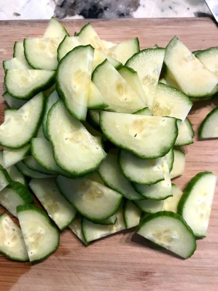 sliced and halved cucumbers