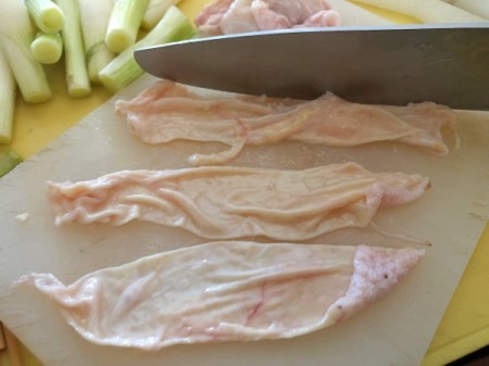 cutting chicken skin