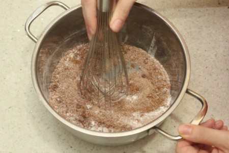 Ingredients for butterscotch pudding being mixed together.