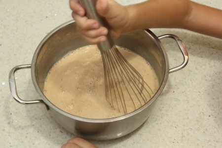 Ingredients for butterscotch pudding being mixed together.