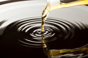 vinegar being poured into a pool of water.