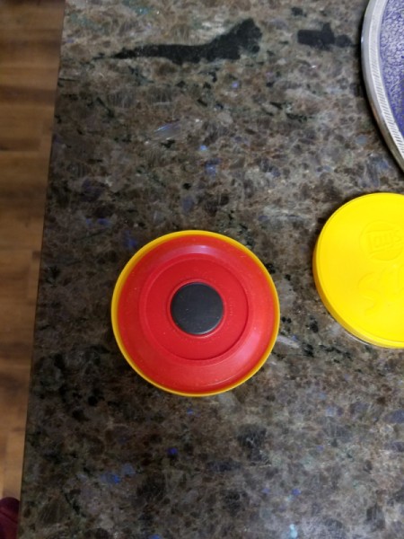 The magnet placed inside one of the lids.