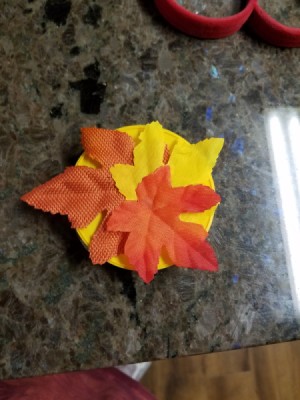 A tiny gift box made from lids from Stax potato chips.