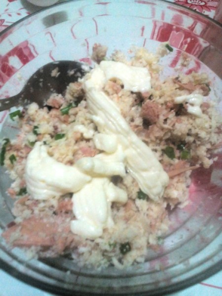 adding mayonnaise to mix