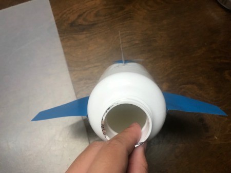 Travel Fund - Airplane Piggy Bank - front view of bottle with wings and tail in place