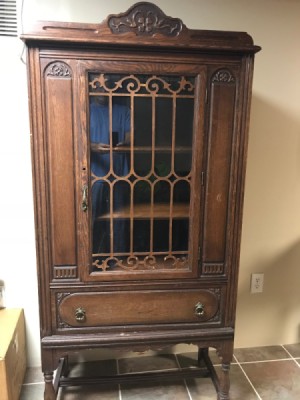 Identifying an Ornate Cabinet  - ornate perhaps antique cabinet with shelves, decorative glass door and lower drawer
