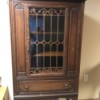 Identifying an Ornate Cabinet  - ornate perhaps antique cabinet with shelves, decorative glass door and lower drawer