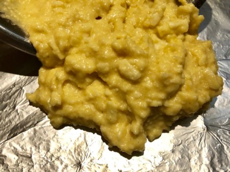 pouring dough on baking sheet
