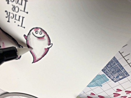 Adding colorful details to the ghost stamp.