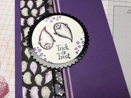 Using a tool to press the decal onto the front of the card.