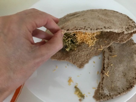 filling pita bread with cheese