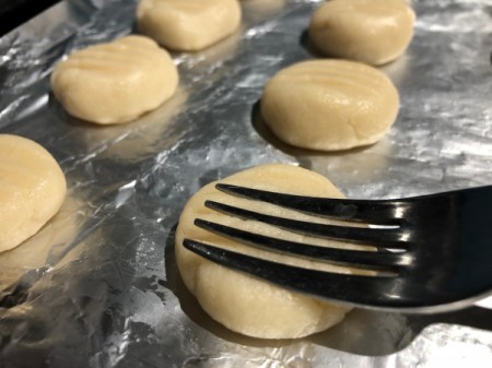smashing cookies with fork