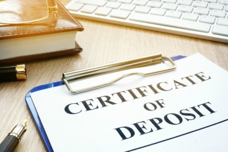 Certificates of Deposit  on a desk.