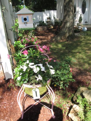 I Love Chairs As Planters In My Garden - round chair planted flowers in the garden
