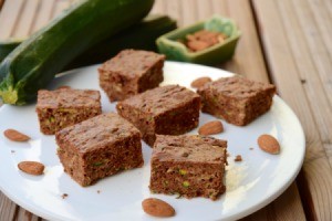 Zucchini Bars on a plate with almonds.