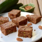 Zucchini Bars on a plate with almonds.