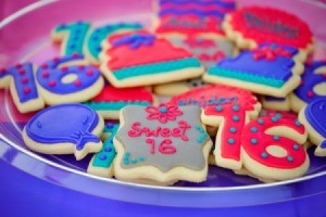 Assorted Sweet 16 frosted cookies on a plate