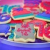 Assorted Sweet 16 frosted cookies on a plate