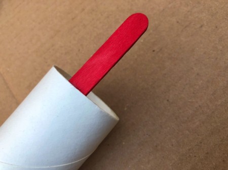 Popsicle Stick Desktop Organizer - glue a cut stick to the inside of the TP paper roll, hold until set