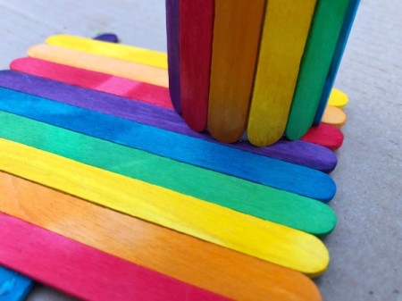 Popsicle Stick Desktop Organizer - apply a lot of glue to the bottom of the tube and glue down to the platform