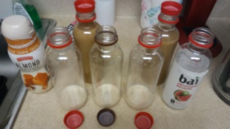 Empty recycled plastic bottles for storing flavored coffee.