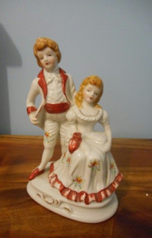 Identifying a Figurine - girl sitting with a boy standing behind her, both in period dress