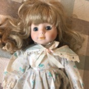 Identifying a Porcelain Doll - doll in blue print dress