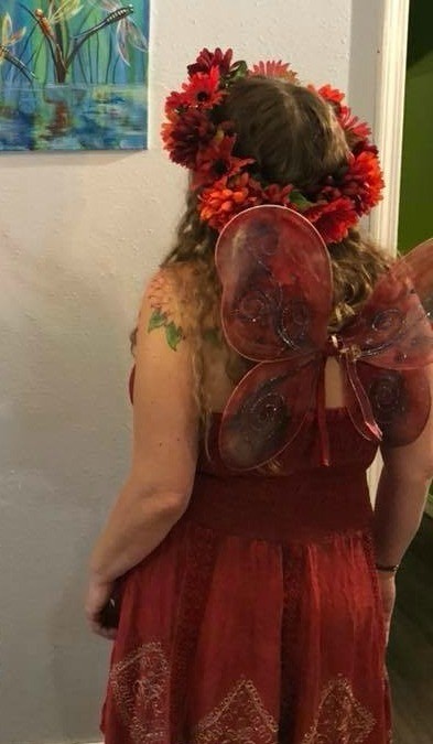 A red fairy costume with wings and a flower crown.