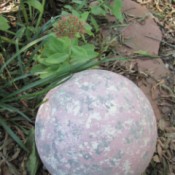 A stone look garden orb made from a bowling ball.