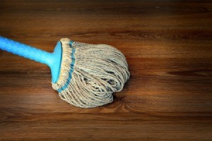 Rag mop on a wood floor.