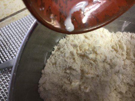 adding heavy cream to dough