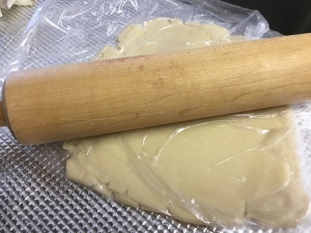 rolling dough in plastic