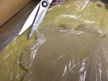 cutting plastic bag with dough