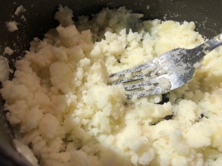 mashing potatoes with a fork
