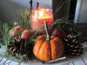 Using Natures Own For Decorations, While Going Green - mini pumpkin gourd, pinecones, apples, greenery and a candle
