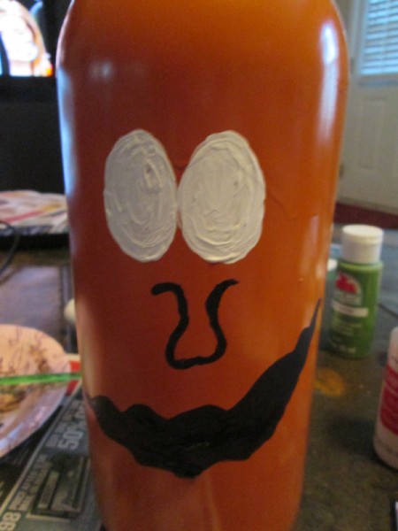 Jack-'o-Lantern Painted Wine Bottles - painting on face