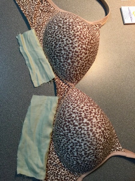 Bra with fabric patches attached to the underside of the bra cups.
