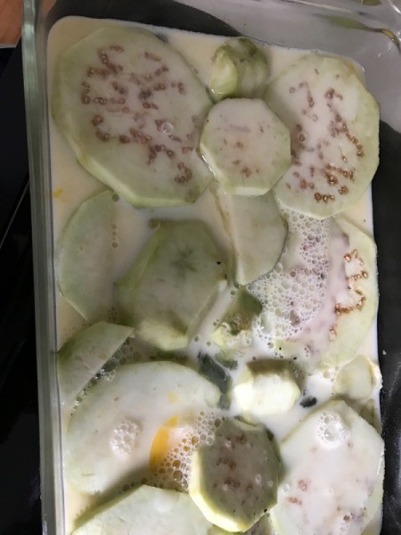 eggs poured over eggplant