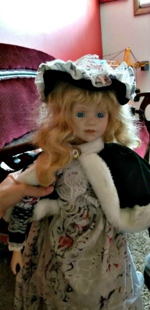 Identifying a Porcelain Doll - doll wearing a fur trimmed cape