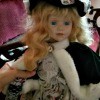 Identifying a Porcelain Doll - doll wearing a fur trimmed cape
