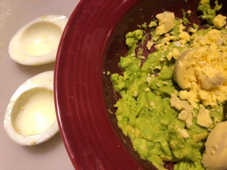 Egg yolks and smashed avocado