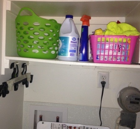 Dirty towels stored in smaller baskets in the laundry room.
