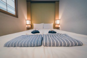 Japanese yukata and towel on bedroom in hotel, Tokyo, Japan.