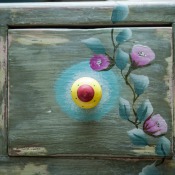 Drawer painted with flowers.