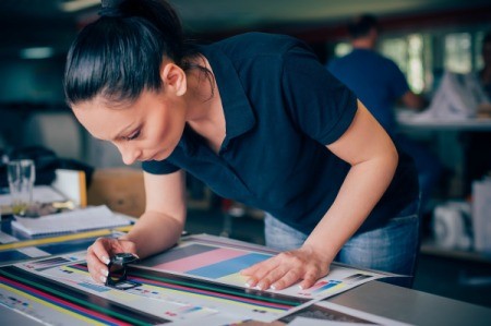 Woman working in a print shop.