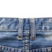 Close up of belt loops on a pair of jeans.