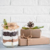 Gift mix in a jar next to boxed gifts.